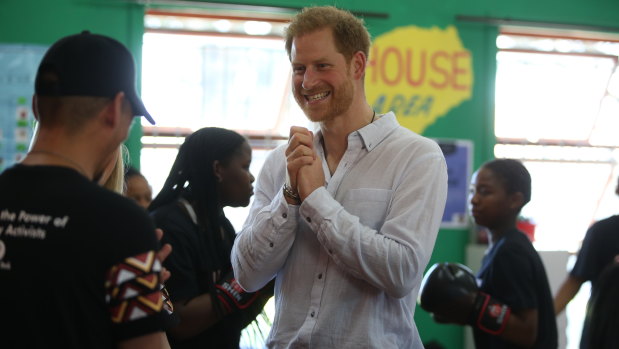 Prince Harry speaks to representatives of the The Justice Desk in the township that is known as the country's "murder capital".