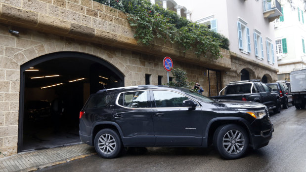 A car leaves the garage of a property owned by Carlos Ghosn in Beirut, Lebanon.