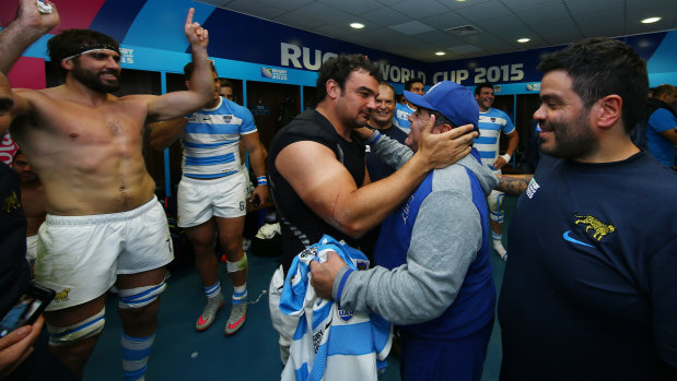 Diego Maradona celebrates with Agustin Creevy in the Argentina dressing room at the 2015 Rugby World Cup.