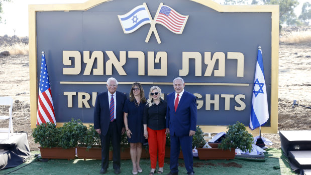 Benjamin Netanyahu, right, his wife Sara , US ambassador to Israel David Friedman, and his wife Tammy pose during the inauguration of a new settlement named after President Donald Trump in the Golan Heights.
