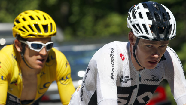 Geraint Thomas, left, wearing the overall leader's yellow jersey, and Chris Froome ride during stage 12.