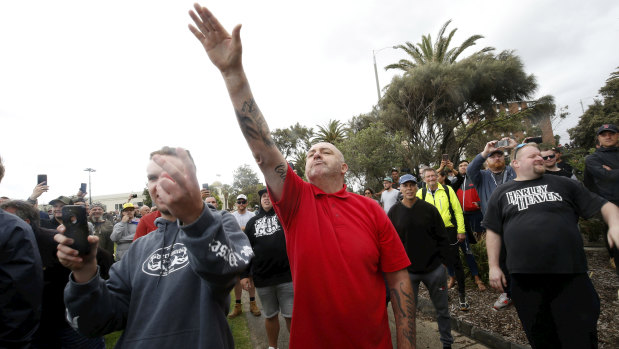 A protester issues a Nazi salute at Saturday's St Kilda rally.