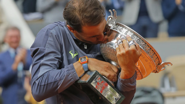 Nadal with the trophy he has made his own.