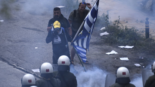 Riot Police clash with protesting opponents of the deal between Greece and Macedonia in northern Greece on Sunday.