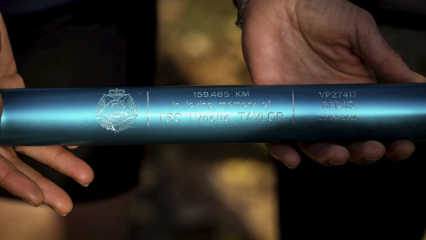 The four blue batons were inscribed with the names of the fallen officers. 