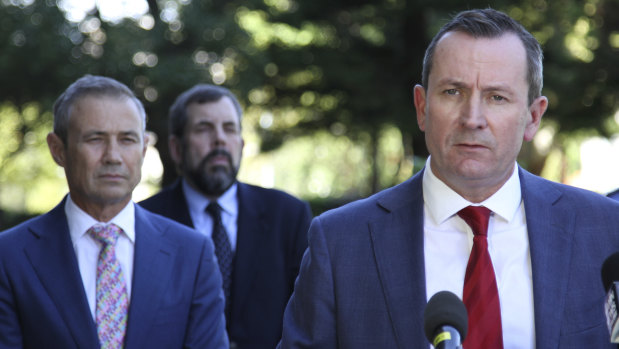 WA Chief Health Officer Andy Robertson stands behind WA Premier Mark McGowan and Health Minister Roger Cook during a press conference in the first half of 2020.  During the early stages of the pandemic, he regularly attended press conferences. 