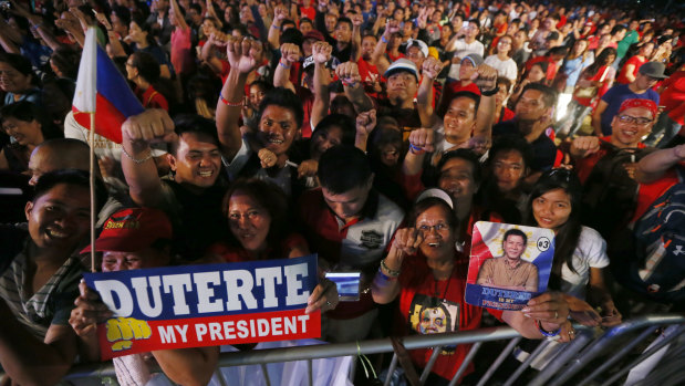 Hundreds of supporters of President Rodrigo Duterte gather at Manila's Rizal Park for an overnight vigil to show support to the president's so-called war on drugs at the anniversary of the near-bloodless revolt that toppled the 20-year-rule of the late dictator Ferdinand Marcos.