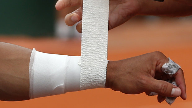 The wrist in question: Nadal gets treatment during the quarter-final.