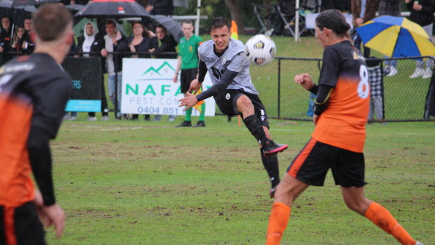 Macarthur midfielder Denis Genreau curls a shot on goal.