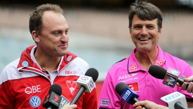 John Longmire of Sydney and Paul Roos of Melbourne prior to the Pink Ladies match between the Swans and Demons in 2015.