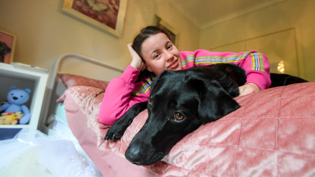 Eliza Robbins-Brown with her TAC-funded dog, Harmony.