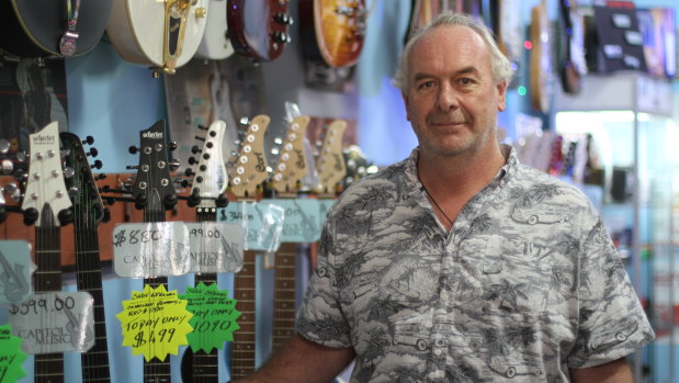 Ashley Hawken says sales have slowed at his music store.