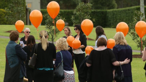 Mourners release balloons at the funeral of Molly Goodbun in 2016.