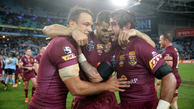 Will Chambers (left) celebrates a Maroons Origin victory with former Storm teammate Greg Inglis (centre) and Johnathan Thurston.