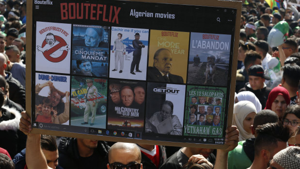 A demonstrator holds a placard during a rally in Algiers.