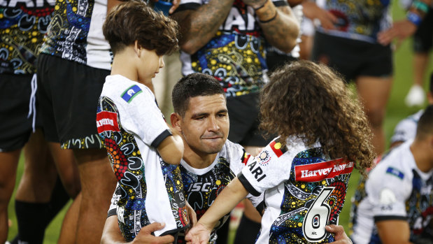 Family matters: Cody Walker with his children after the game.