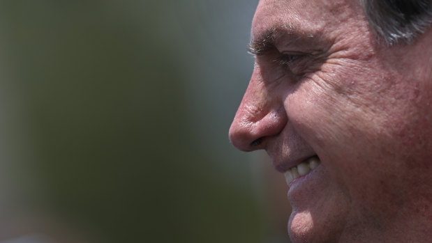 Brazilian President Jair Bolsonaro smiles during a ceremony in celebration of Flag Day last week.