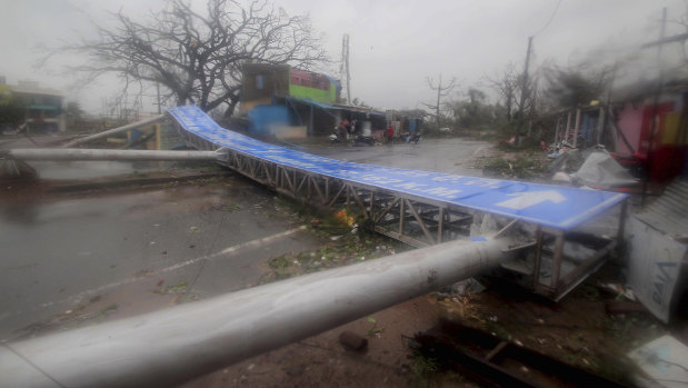Damaged signage lies on a street in Puri, India, after cyclone Fani hit.