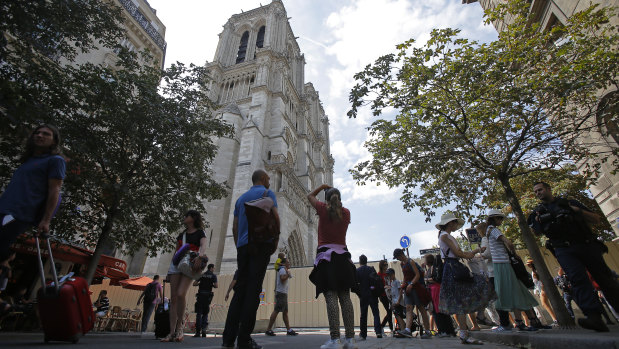 People gather near Notre-Dame Cathedral.