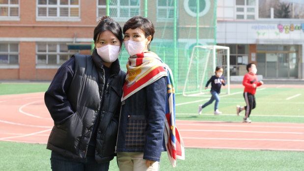Hong Jung-hee, 47, artist, with her 21-year-old daughter at a polling station near Yoon’s residence