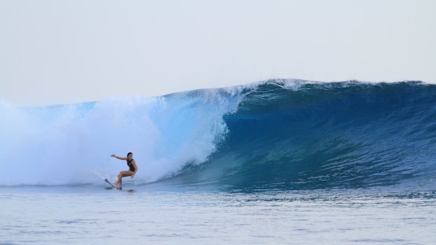 Brooke Farris surfing in Fiji.