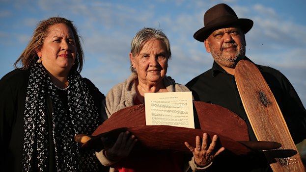 Megan Davis, Pat Anderson and Noel Pearson with a piti holding the Uluru Statement from the Heart.