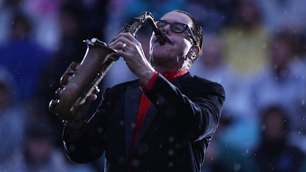 Kirk Pengilly performing with INXS at the 2020 NRL grand final.