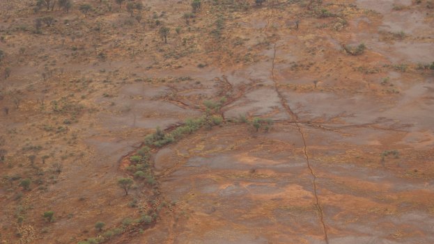 Erosion eating into once-productive grasslands: the soil in the sweetest pasture is removed first. 