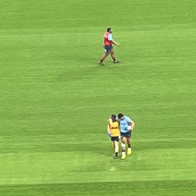 Joseph-Aukuso Suaalii being helped off the field.