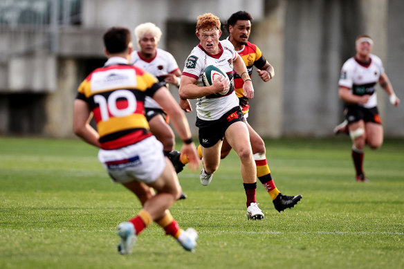 Tane Edmed makes a break for North Harbour against Waikato.