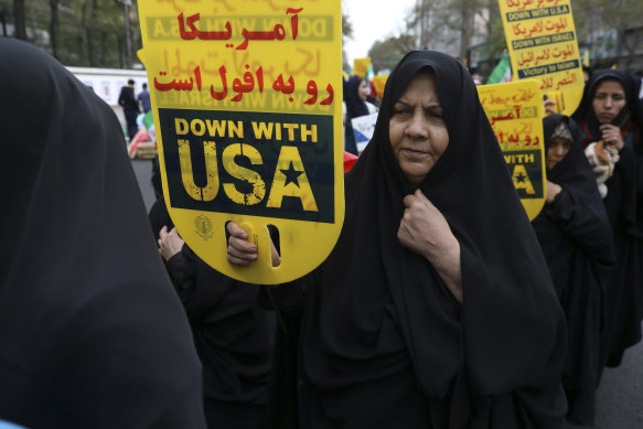 Demonstrators hold anti-US banners during a rally in front of the former US embassy in Tehran, Iran, on Monday.