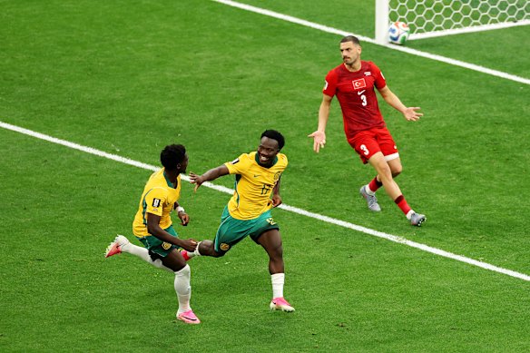 Nestory Irankunda, right, celebrates his goal against Turkey.