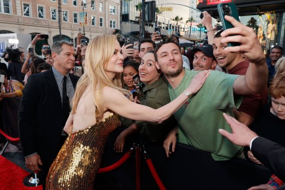 Nicole Kidman takes a selfie with a fan before the gala event.