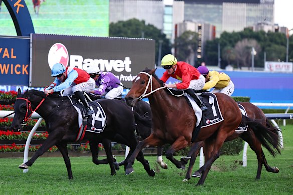 Glorious Moments, right, swoops down the outside to win at Randwick on June 20.