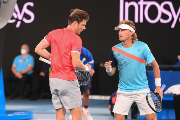 Matt Ebden (left) and Max Purcell in action at the men’s doubles final on Saturday night. 