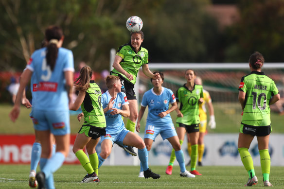 Canberra's Kendall Fletcher heads the ball during round two between United and Melbourne City. 