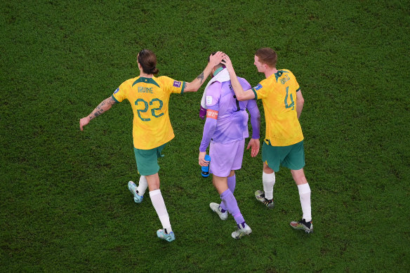 Jackson Irvine and Kye Rowles console Mat Ryan.