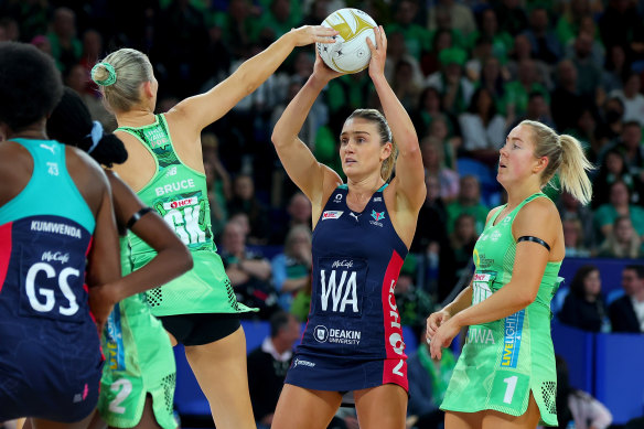 Liz Watson of the Vixens looks to pass the ball against the West Coast Fever.