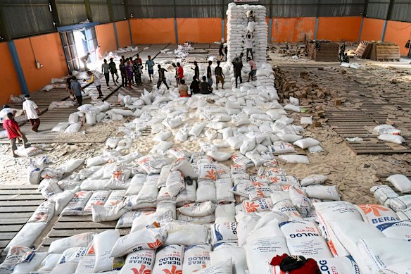 Villagers receive free sacks of rice from the Indonesian military at Sarudik in North Sumatra province on Wednesday.