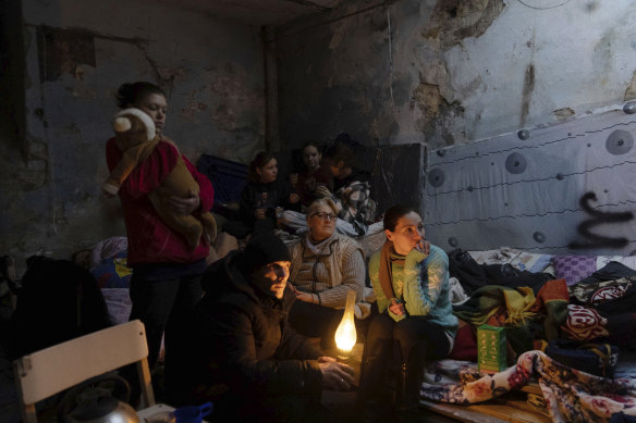 A family huddled in a bomb shelter in Mariupol on March 6.