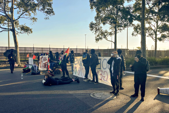 Activists block the intersection of Lorimer and Salmon streets in Port Melbourne.