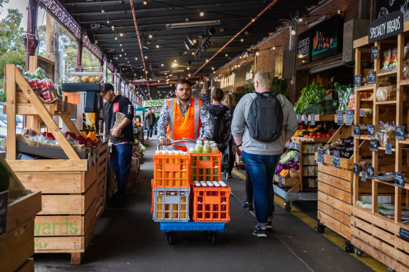 Shoppers and workers at the market on Wednesday.