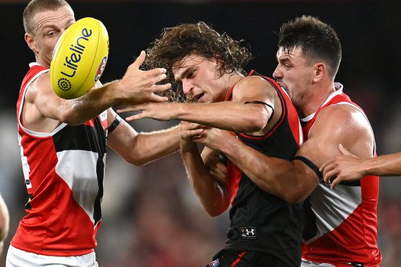 Essendon’s Harrison Jones (centre) has sustained an ankle injury on the eve of the season.