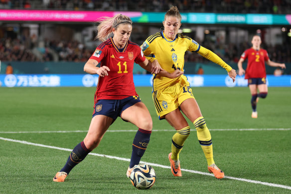 Alexia Putellas of Spain and Filippa Angeldal of Sweden compete for the ball.