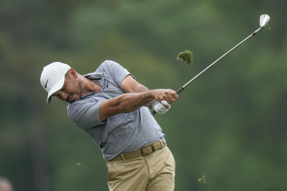 Jason Day hits the tee at the 12th.