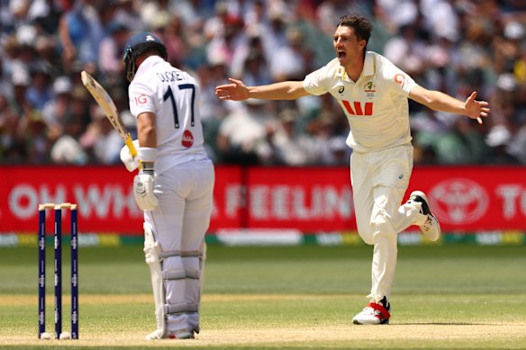 Pat Cummins celebrates taking the wicket of Ben Duckett for four runs during day four of the Third Test in Adelaide.