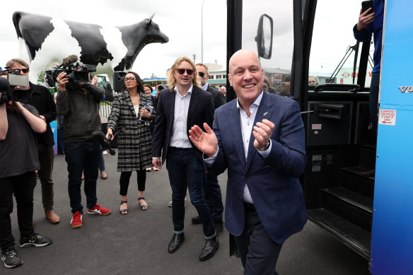 National Party leader Chris Luxon, right, meets locals in Morrinsville on Friday.