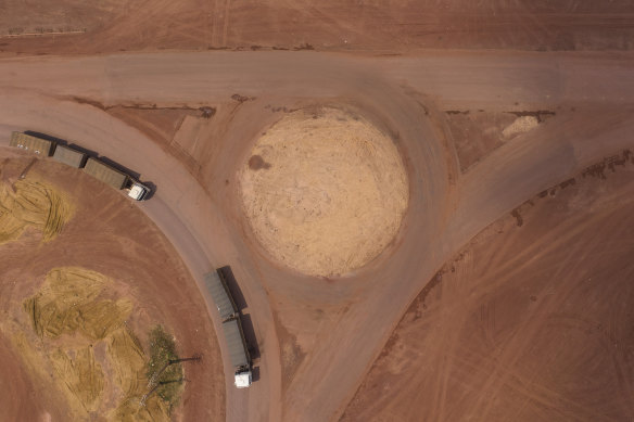 Trucks turn off the Trans-Amazon highway onto route BR-163, built to bend nature to man's will in Campo Verde, near Itaituba, Para state, Brazil.