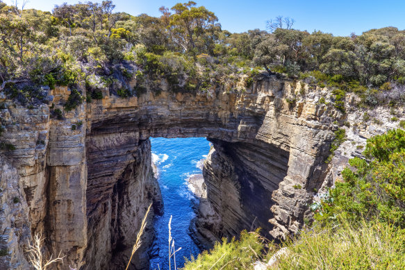 Tasmans Arch, a natural rock bridge over the sea at Eaglehawk Neck, near Port Arthur, Tasmania. 