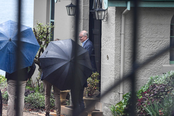 Scott Morrison leaves Kirribilli House in Sydney with his family on Sunday morning.